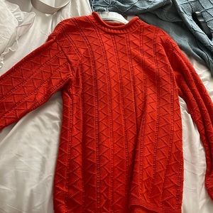 Orange sweater, size medium.